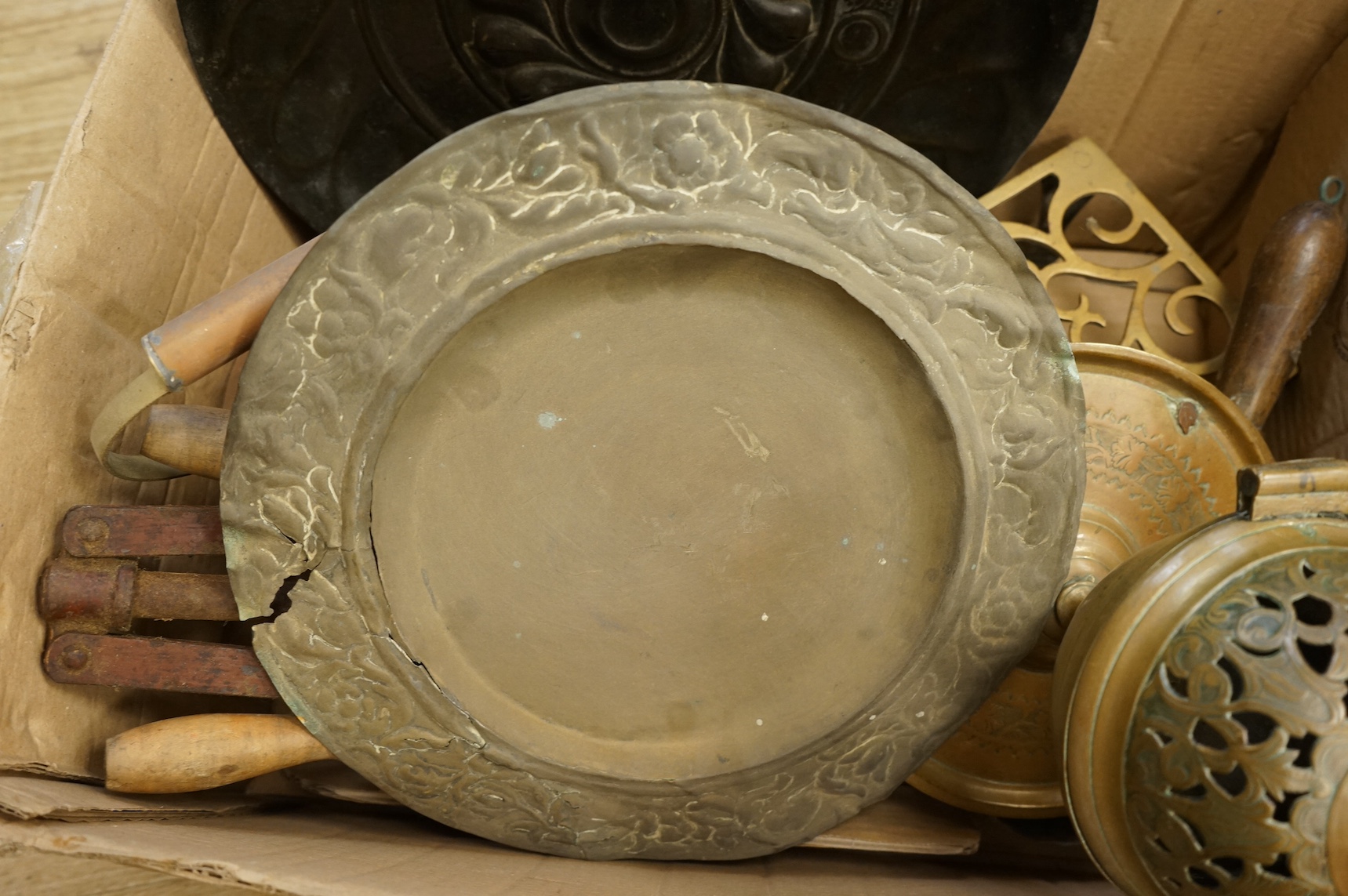 A 17th century Nuremburg embossed brass alms dish, and other metalware, dish 34cm. Condition - worn